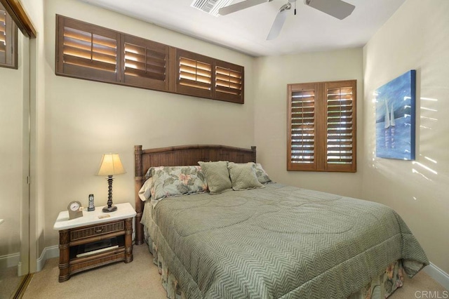 carpeted bedroom featuring ceiling fan and baseboards