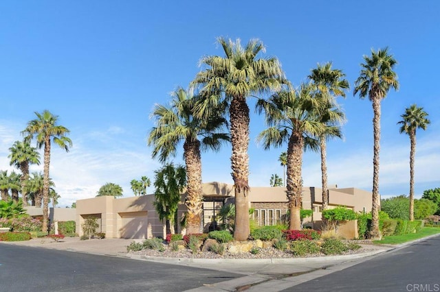 southwest-style home featuring stucco siding