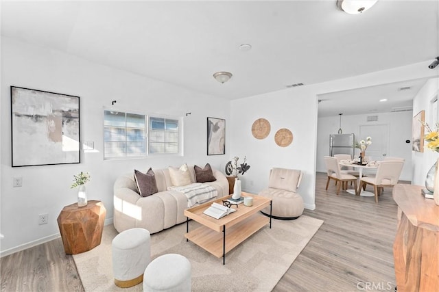 living room featuring light wood-type flooring