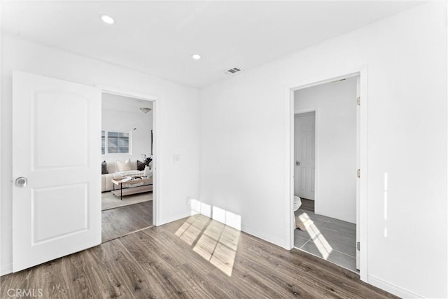 empty room with hardwood / wood-style flooring