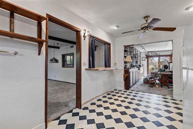 hallway with light colored carpet