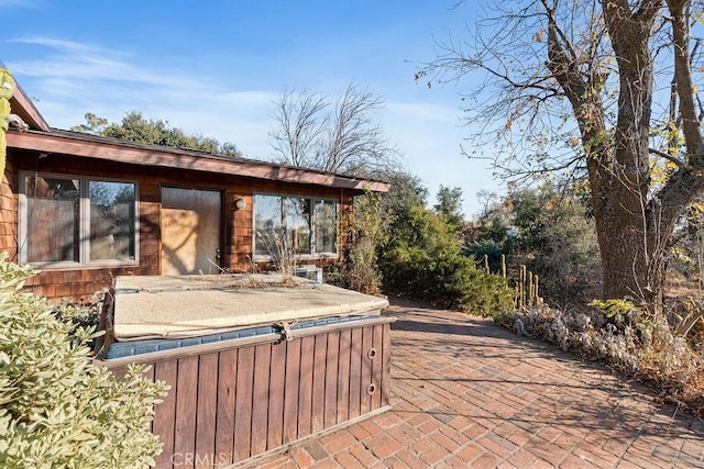 view of patio / terrace featuring a hot tub