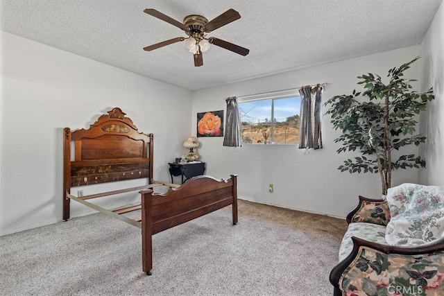 carpeted bedroom with a textured ceiling and ceiling fan