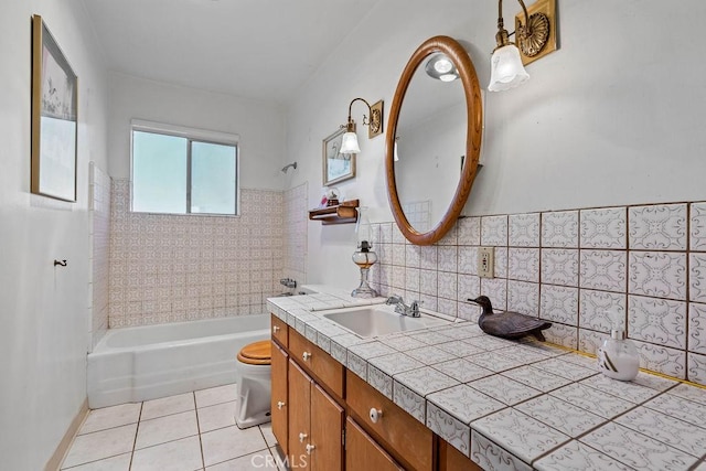 full bathroom with tiled shower / bath combo, tile patterned flooring, vanity, backsplash, and toilet