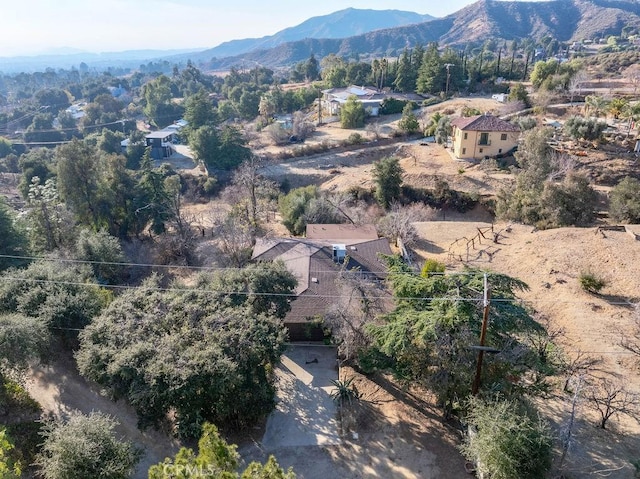 birds eye view of property featuring a mountain view