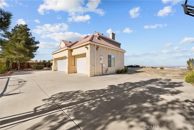 view of side of property with a garage