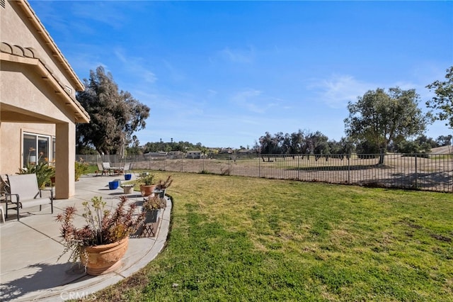 view of yard with a patio and a fenced backyard