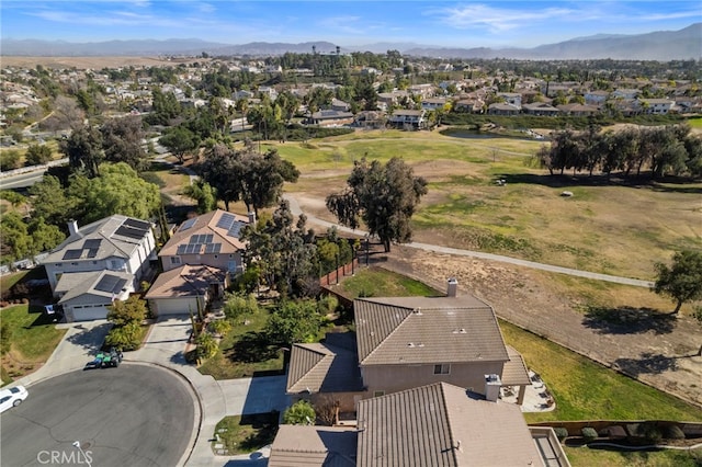 birds eye view of property with a mountain view and a residential view