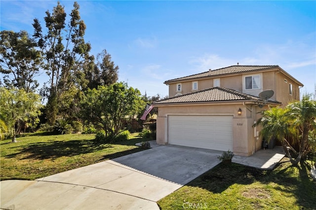 traditional-style home with a garage, a tile roof, concrete driveway, stucco siding, and a front yard