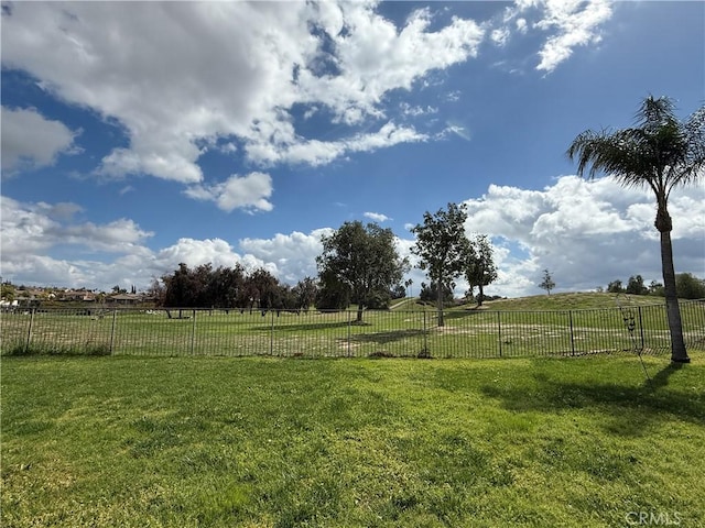 view of yard featuring a rural view and fence