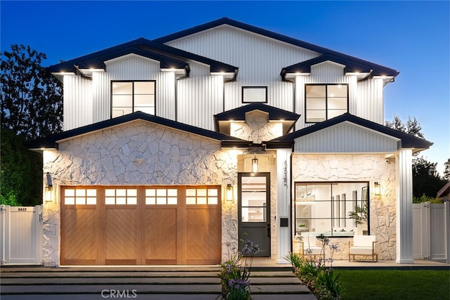 modern inspired farmhouse with a garage