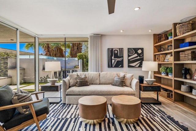 living room with hardwood / wood-style flooring and expansive windows