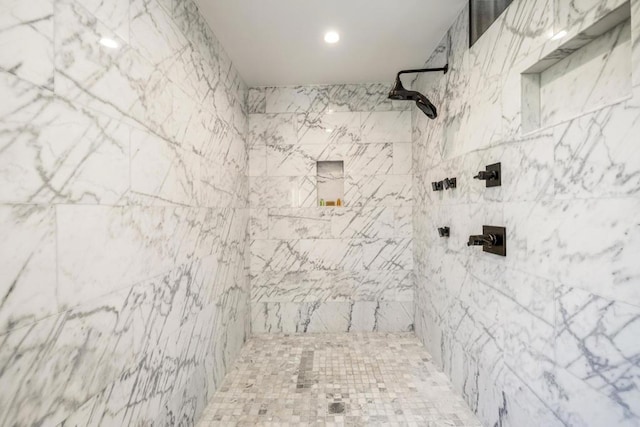 bathroom featuring a tile shower