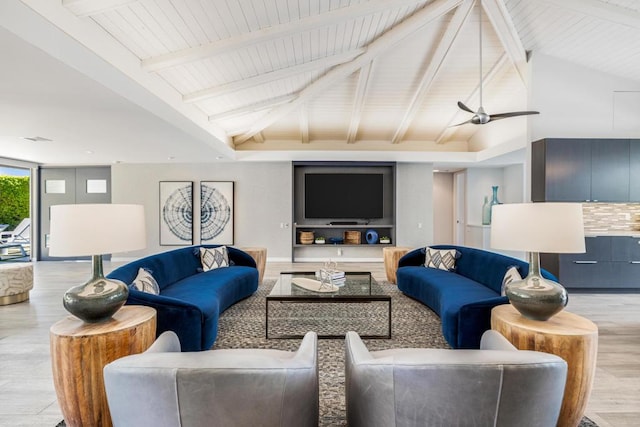 living room with beam ceiling and light hardwood / wood-style floors