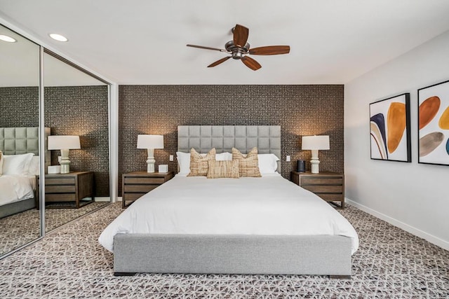 bedroom featuring ceiling fan, a closet, and carpet flooring