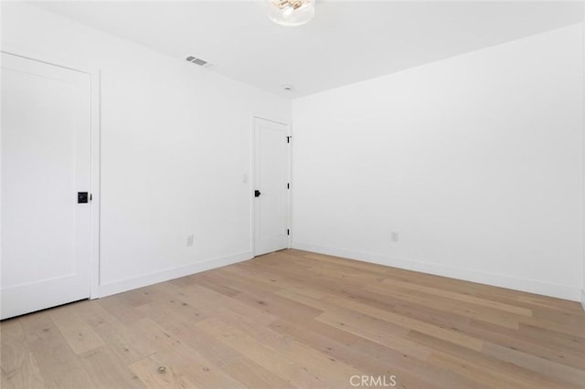 empty room featuring light hardwood / wood-style floors