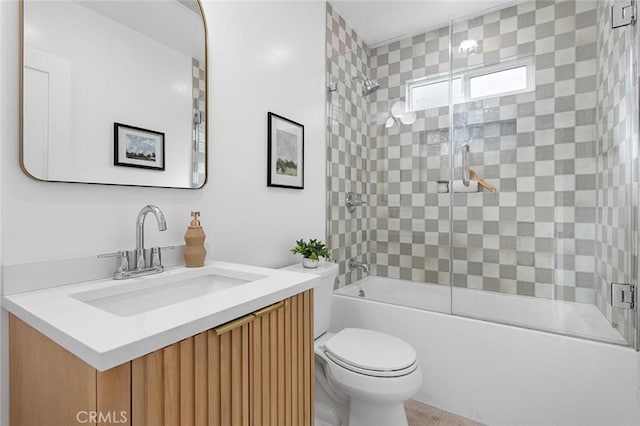 full bathroom with vanity, toilet, and combined bath / shower with glass door