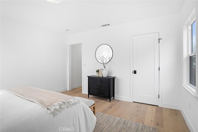 bedroom with light wood-type flooring