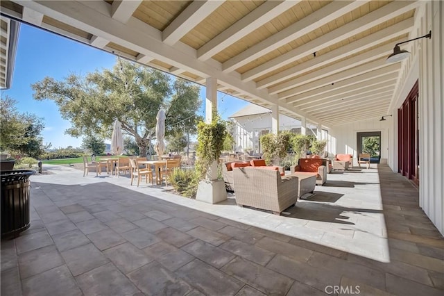 view of patio / terrace featuring outdoor dining space and an outdoor living space