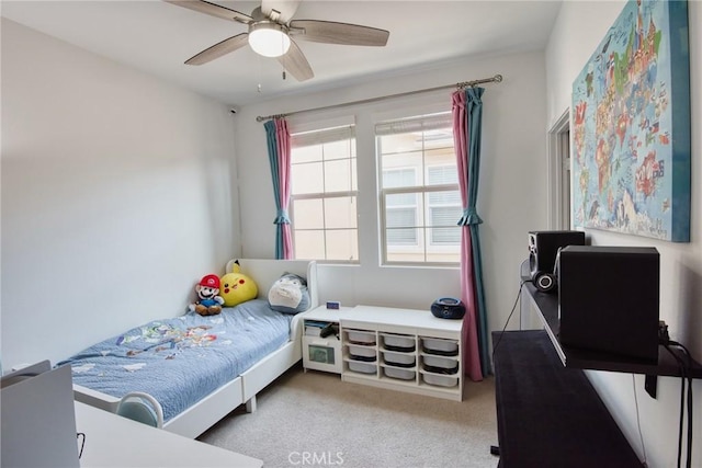 bedroom with ceiling fan and light colored carpet