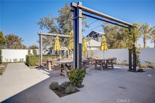 view of patio / terrace featuring outdoor dining area and a fenced backyard