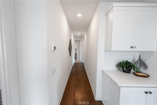 hall featuring dark wood-type flooring