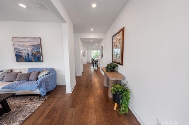 corridor with dark hardwood / wood-style floors