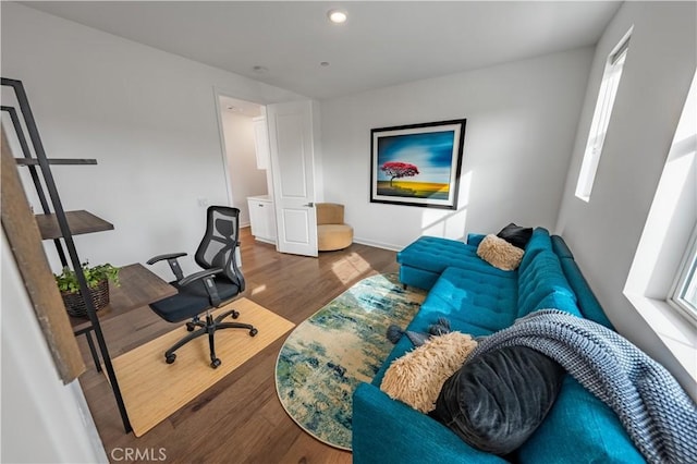 office with dark hardwood / wood-style flooring