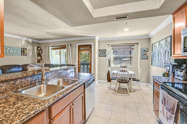 kitchen featuring sink, stainless steel appliances, dark stone countertops, light tile patterned floors, and ornamental molding