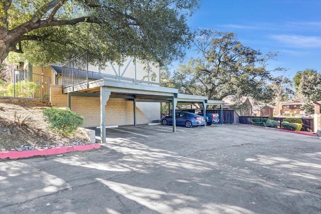 view of vehicle parking featuring a carport