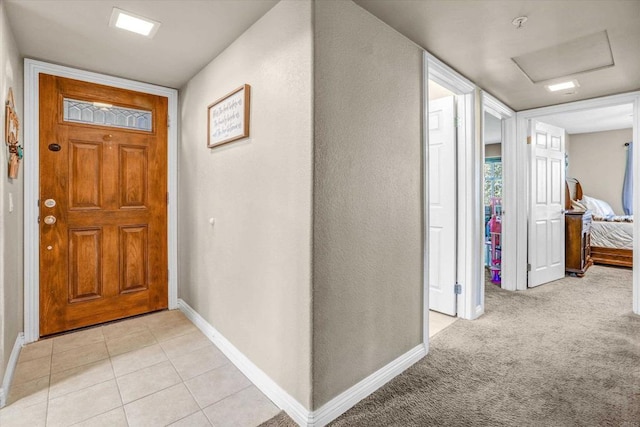 view of carpeted entrance foyer