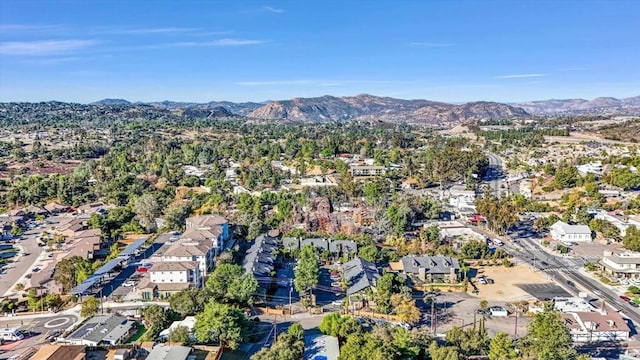 birds eye view of property featuring a mountain view