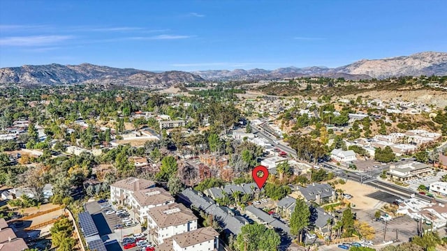 birds eye view of property with a mountain view