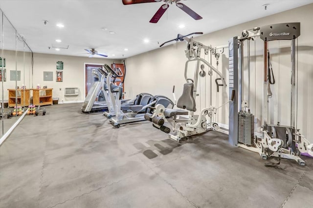 workout area with ceiling fan and a wall mounted air conditioner