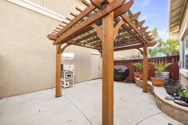 view of patio featuring a pergola and a grill