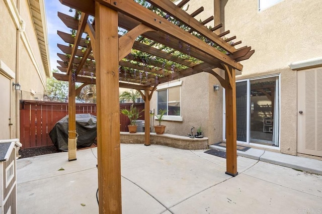 view of patio / terrace with a pergola and grilling area