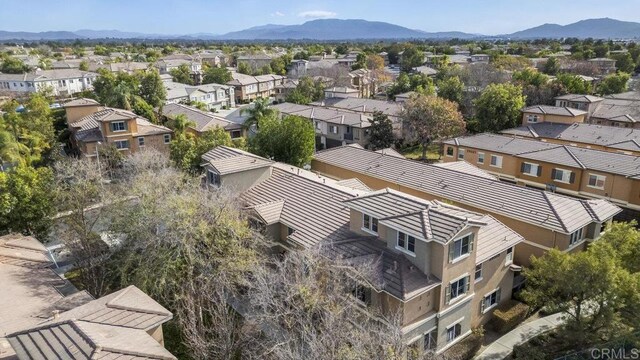 birds eye view of property with a mountain view