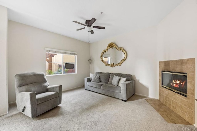 living room with ceiling fan, carpet flooring, and a fireplace