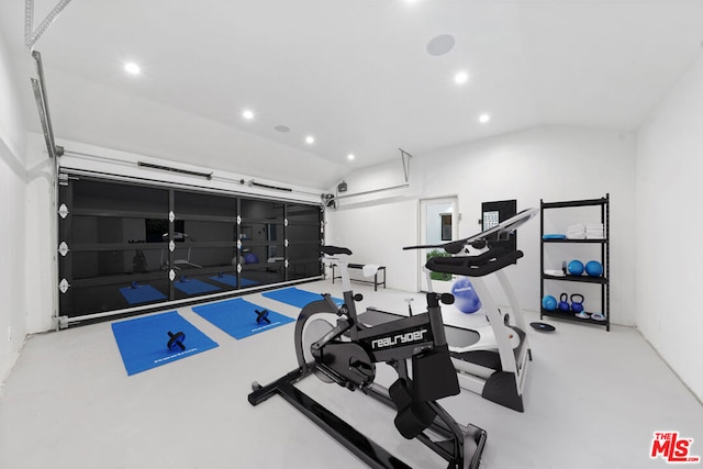 workout room with vaulted ceiling