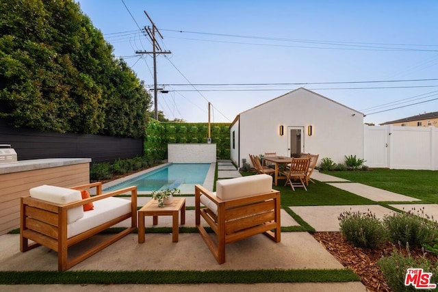 view of patio featuring a fenced in pool