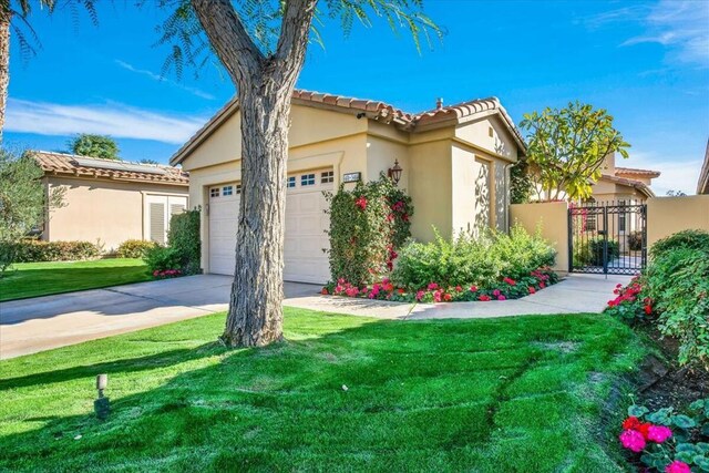 view of front of home with a garage and a front yard