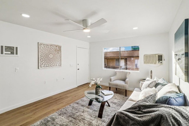 living room featuring ceiling fan and light wood-type flooring