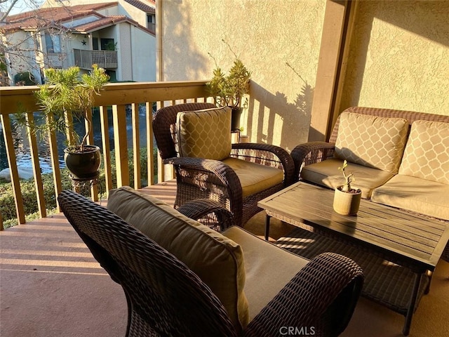 balcony featuring a water view