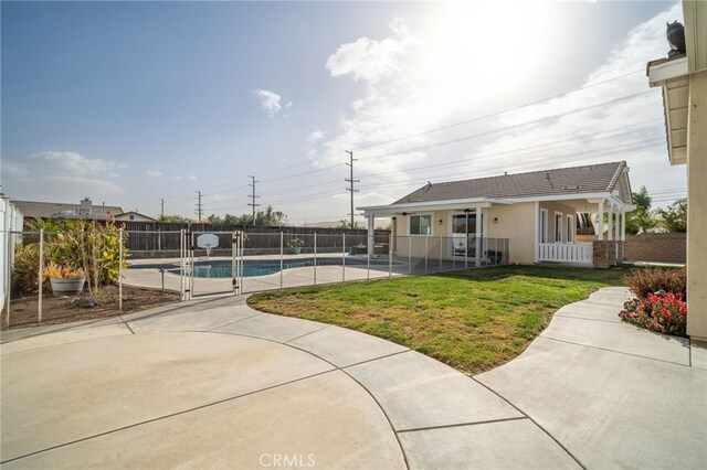 exterior space with a lawn and a patio