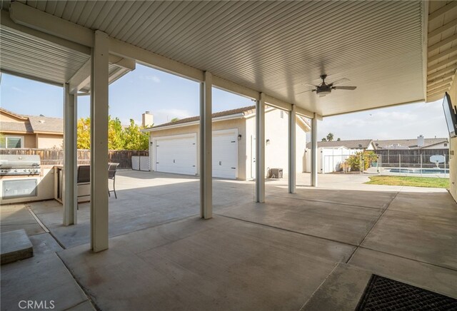 view of patio with ceiling fan, a swimming pool, a grill, and a garage