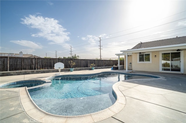 view of pool featuring an in ground hot tub and a patio