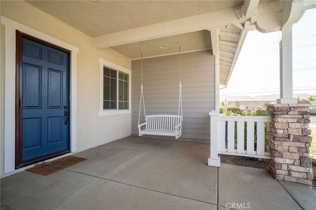 entrance to property with covered porch