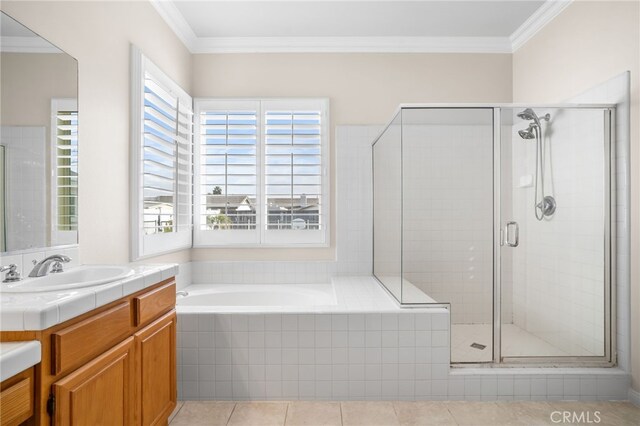 bathroom with vanity, ornamental molding, independent shower and bath, and tile patterned flooring