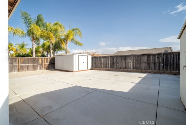 view of patio featuring a shed