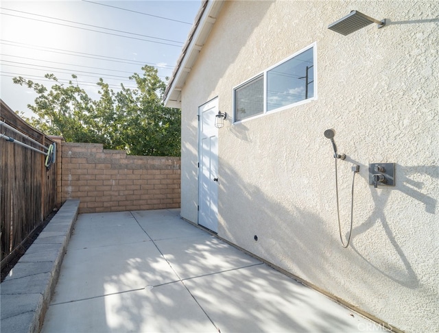 view of side of property featuring a patio